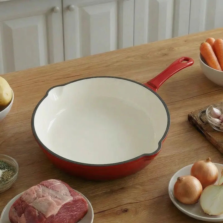 Red enameled cast iron pan with premium non-toxic enamel coating, induction compatible, high-heat cooking ready, and easy-to-clean surface. Perfect for everyday cooking, durable and long-lasting.