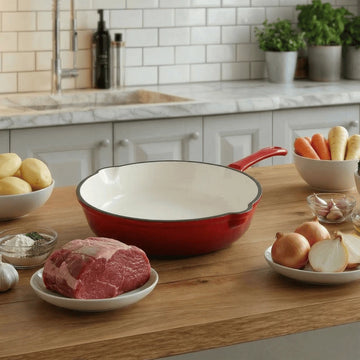 Red enameled cast iron pan with premium non-toxic enamel coating, induction compatible, high-heat cooking ready, and easy-to-clean surface. Perfect for everyday cooking, durable and long-lasting.