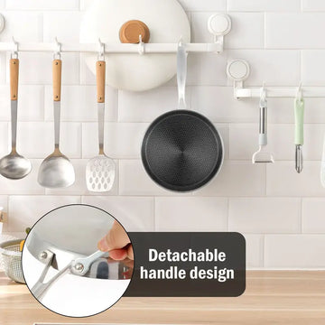 stainless steel hexclad honeycomb non-stick crepe pan 26cm on a kitchen worktop with cooking ingredients