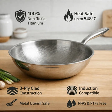 Non-toxic titanium hammered wok with 3-ply construction, induction-ready stainless steel base and ergonomic stay-cool handle.